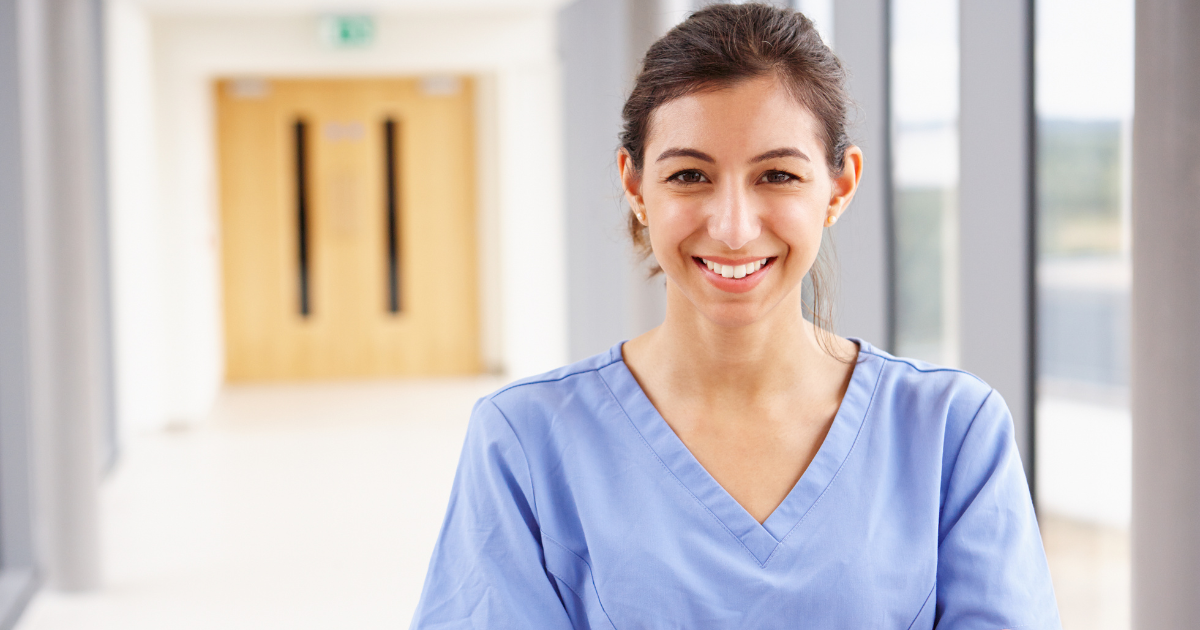 A caregiver looks happy as she looks forward to her career in home care!