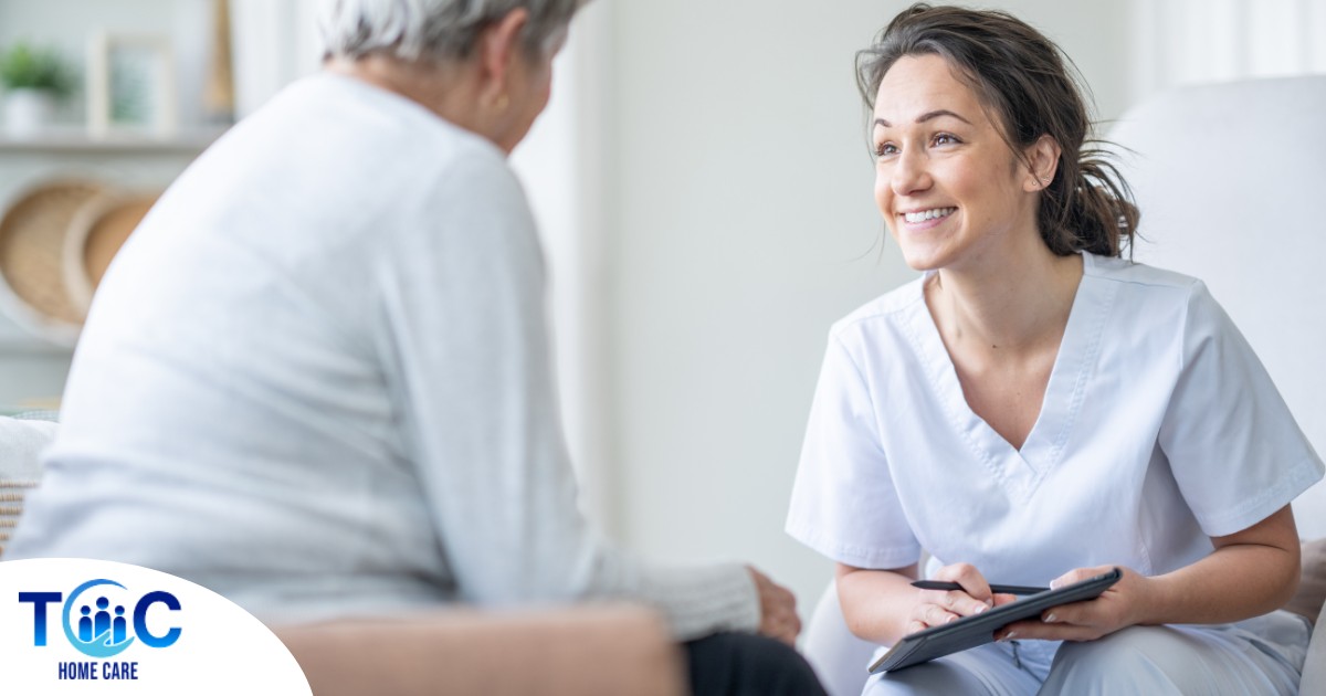 A woman smiles while with a client representing the pros of the home care industry.