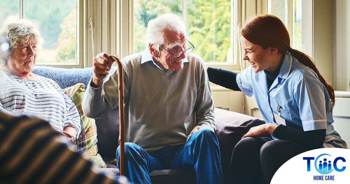 A woman has a good time with her older clients, representing the kind of personal skills needed to be a good caregiver.