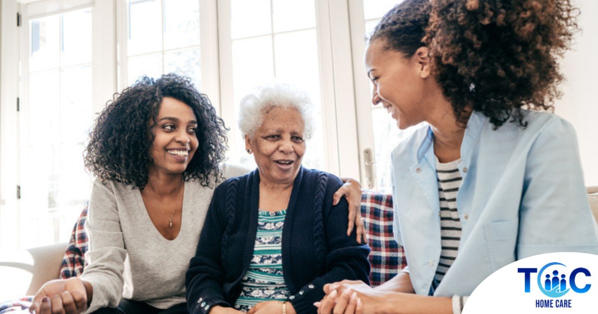 Caregiver talking to a family about Elderly Care