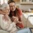 Caregiver supporting an elderly woman in the transition to senior home care