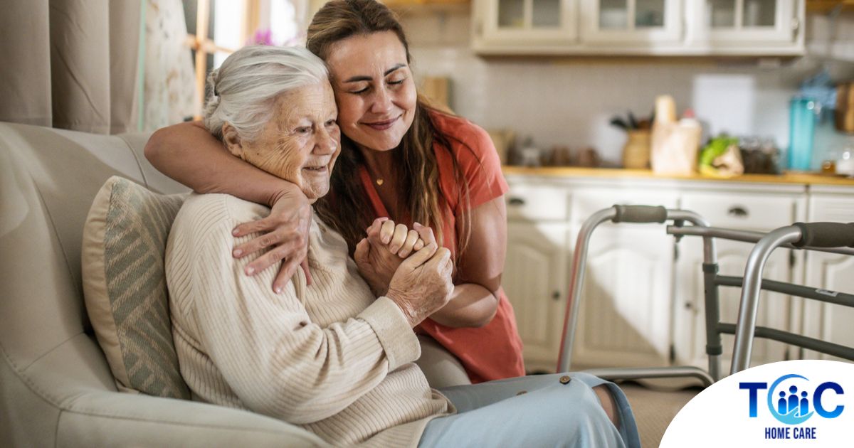 Caregiver supporting an elderly woman in the transition to senior home care