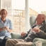 A caregiver provides Memory Care at Home to a senior