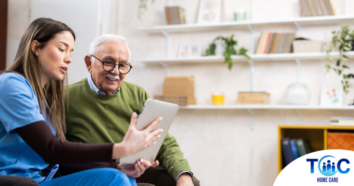 Home caregiver assisting senior man to use telehealth and senior care